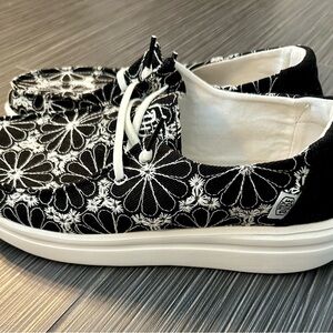 Hey Dude shoes. New. Size 9. Black and white floral print.